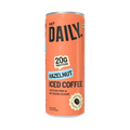 An orange can of Get Daily Hazelnut Iced Coffee protein powder, featuring bold black text, a light blue 'HAZELNUT' banner, and a gold badge indicating 20g protein.